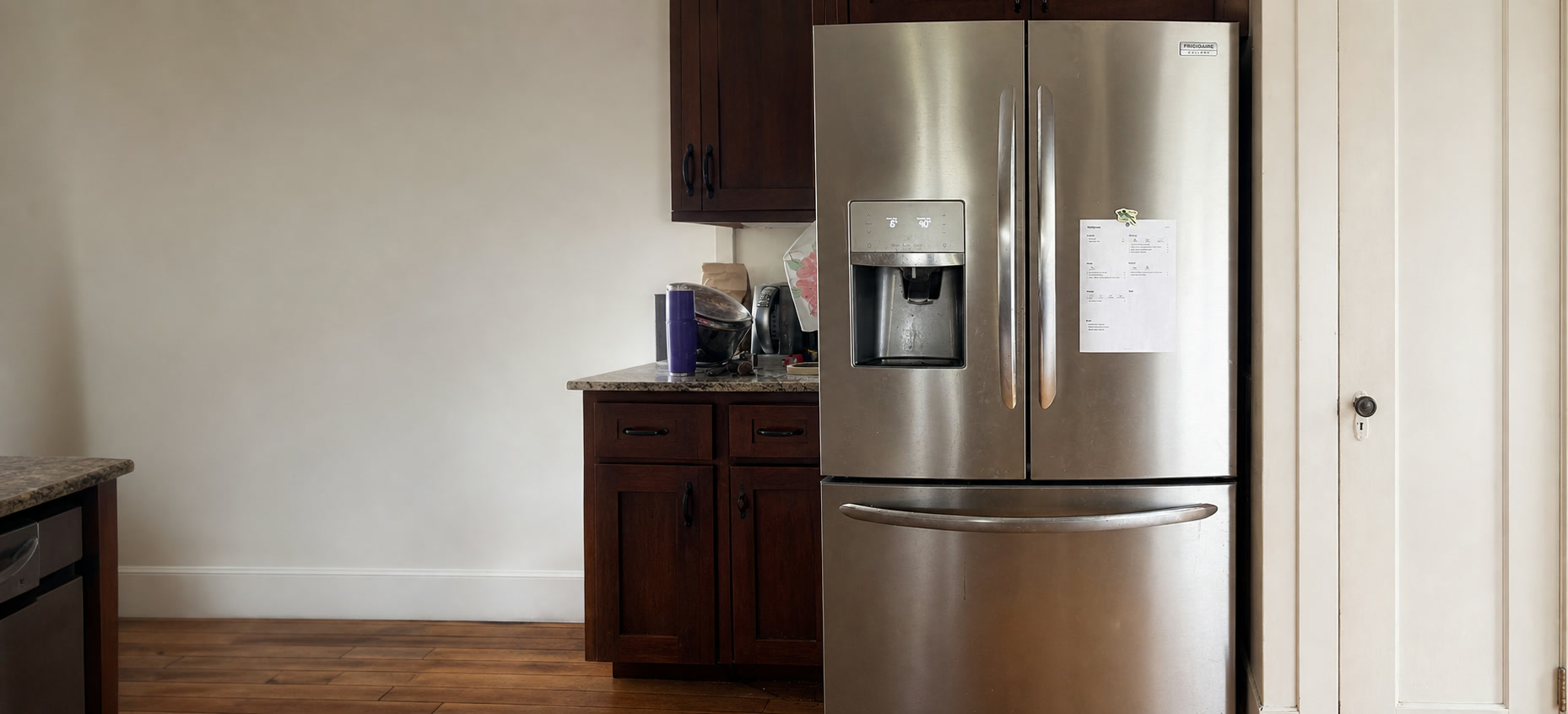 A printed Choreeo chore chart with habit squares and chore rows, held to a refrigerator door with magnets.